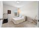 Bedroom with neutral walls and carpet, a window, a bed, and a small exercise machine at 850 Ethereow Ct, Lawrenceville, GA 30046