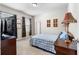 A cozy bedroom featuring a large window and a comfortable bed with blue accents at 850 Ethereow Ct, Lawrenceville, GA 30046