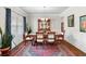 Elegant dining room with a large window and stylish decor, ideal for Gathering meals and gatherings at 850 Ethereow Ct, Lawrenceville, GA 30046