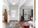 Bright entryway featuring hardwood floors, a decorative rug, and views into the living spaces at 850 Ethereow Ct, Lawrenceville, GA 30046