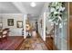 Elegant foyer with hardwood floors, wainscoting, and stylish decor leading into the home at 850 Ethereow Ct, Lawrenceville, GA 30046