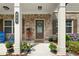 Welcoming front door with a wreath, plants, and decorative features enhancing the home's curb appeal at 850 Ethereow Ct, Lawrenceville, GA 30046