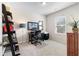 A bright home office features neutral carpet, a large desk, and a charming leaning bookshelf at 850 Ethereow Ct, Lawrenceville, GA 30046