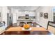 Bright kitchen featuring white cabinetry, stainless steel appliances, and a granite island at 850 Ethereow Ct, Lawrenceville, GA 30046