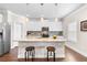Spacious kitchen island featuring pendant lighting, granite counters, and stainless appliances at 850 Ethereow Ct, Lawrenceville, GA 30046