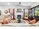 Bright and inviting living room with a fireplace, stylish decor, and comfortable seating, perfect for relaxation at 850 Ethereow Ct, Lawrenceville, GA 30046