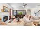 Spacious living room with a fireplace, built-in shelving, and comfortable seating, ideal for Gathering gatherings at 850 Ethereow Ct, Lawrenceville, GA 30046