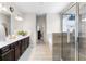 A luxurious main bathroom with double sink vanity, stand alone tub, and glass shower at 850 Ethereow Ct, Lawrenceville, GA 30046