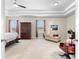 A large main bedroom features a tray ceiling and sitting area near windows at 850 Ethereow Ct, Lawrenceville, GA 30046