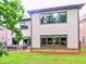 A spacious backyard features lush green grass and a patio with comfortable seating at 913 Sunny Meadows Ln, Marietta, GA 30062