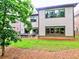 A spacious backyard features lush green grass and a patio with comfortable seating at 913 Sunny Meadows Ln, Marietta, GA 30062