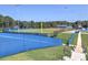 View of baseball field featuring manicured grass, modern lighting, and blue fencing at 913 Sunny Meadows Ln, Marietta, GA 30062