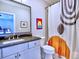 Stylish bathroom features a modern vanity and a unique shower curtain design at 913 Sunny Meadows Ln, Marietta, GA 30062