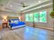 Spacious bedroom with tray ceiling, large windows, and hardwood floors at 913 Sunny Meadows Ln, Marietta, GA 30062