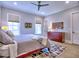 Primary bedroom with wood floors, plenty of natural light, and a ceiling fan at 913 Sunny Meadows Ln, Marietta, GA 30062