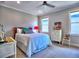 Comfortable bedroom with carpet, lots of natural light, and a ceiling fan at 913 Sunny Meadows Ln, Marietta, GA 30062