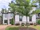 Charming two-story home with light colored brick, landscaped yard, and brick driveway at 913 Sunny Meadows Ln, Marietta, GA 30062
