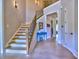 Bright foyer with hardwood floors, a staircase with metal spindles, and classic lighting at 913 Sunny Meadows Ln, Marietta, GA 30062