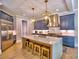 Modern kitchen featuring stainless steel appliances and a spacious island with seating at 913 Sunny Meadows Ln, Marietta, GA 30062