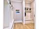Mudroom with built-in bench, storage cubbies, and coat hooks at 913 Sunny Meadows Ln, Marietta, GA 30062