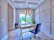Bright office space with an elegant chandelier, hardwood floors, and paneling at 913 Sunny Meadows Ln, Marietta, GA 30062