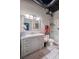 Bathroom featuring updated vanity, tiled floors, and a glass-enclosed shower at 120 Ralph Mcgill Ne Blvd # 1409, Atlanta, GA 30308