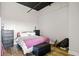 Cozy bedroom with a comfortable bed and dark wood furniture at 120 Ralph Mcgill Ne Blvd # 1409, Atlanta, GA 30308