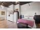 Spacious bedroom featuring wood floors, black ceiling, and exposed piping for an industrial feel at 120 Ralph Mcgill Ne Blvd # 1409, Atlanta, GA 30308