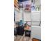 Well-organized closet with stacked washer/dryer unit, shelves, and storage space at 120 Ralph Mcgill Ne Blvd # 1409, Atlanta, GA 30308
