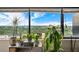 Bright living room featuring large windows, plants, and views of the city skyline at 120 Ralph Mcgill Ne Blvd # 1409, Atlanta, GA 30308