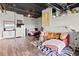 Open concept living space with bed, couch, and entertainment area at 120 Ralph Mcgill Ne Blvd # 1409, Atlanta, GA 30308
