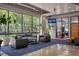 Lobby area boasting modern seating, large windows with lush greenery at 120 Ralph Mcgill Ne Blvd # 1409, Atlanta, GA 30308