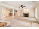 Finished basement with a stone fireplace, bar area, and access to the backyard at 317 Saint Pauls Ct, Stockbridge, GA 30281