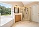 Bathroom with a separate bathtub, shower, and vanity with cabinet at 317 Saint Pauls Ct, Stockbridge, GA 30281