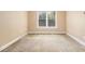 Cozy bedroom with plush carpet and a sunlit window at 317 Saint Pauls Ct, Stockbridge, GA 30281