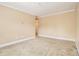 Neutral bedroom featuring carpet flooring, baseboard trim, and light beige paint at 317 Saint Pauls Ct, Stockbridge, GA 30281
