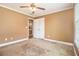 Bedroom features a ceiling fan and an ensuite bathroom for added convenience at 317 Saint Pauls Ct, Stockbridge, GA 30281