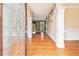 Inviting foyer with hardwood floors, decorative glass door, and elegant trim work at 317 Saint Pauls Ct, Stockbridge, GA 30281