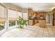 Eat-in kitchen bathed in sunlight featuring stone floors and light wood cabinetry at 317 Saint Pauls Ct, Stockbridge, GA 30281