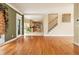 Open floorplan with hardwood floors leading to the kitchen and stairway at 317 Saint Pauls Ct, Stockbridge, GA 30281