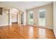 Bright and airy living space with hardwood floors, classic moldings, and transom windows at 317 Saint Pauls Ct, Stockbridge, GA 30281