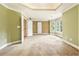 Large main bedroom features neutral carpeting, crown molding, and many windows at 317 Saint Pauls Ct, Stockbridge, GA 30281