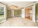 Large main bedroom featuring neutral carpeting, crown molding, and tray ceiling with fan at 317 Saint Pauls Ct, Stockbridge, GA 30281