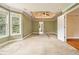 Spacious bedroom with large windows, tray ceiling, and en suite bathroom at 317 Saint Pauls Ct, Stockbridge, GA 30281