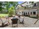 Landscaped backyard with a fire pit area, perfect for outdoor gatherings at 4300 May Apple Dr, Alpharetta, GA 30005