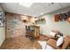 Basement bar area with brick accents, comfortable seating, and stylish decor at 4300 May Apple Dr, Alpharetta, GA 30005