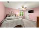 Bedroom with pink walls, large windows, and plush carpet flooring at 4300 May Apple Dr, Alpharetta, GA 30005