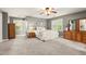 Spacious bedroom with neutral gray walls, soft carpet, and large windows at 4300 May Apple Dr, Alpharetta, GA 30005