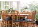 Cozy dining room with a wood table and chairs at 4300 May Apple Dr, Alpharetta, GA 30005