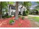 Charming two-story home with a well-manicured lawn, American flag, and a large driveway at 4300 May Apple Dr, Alpharetta, GA 30005